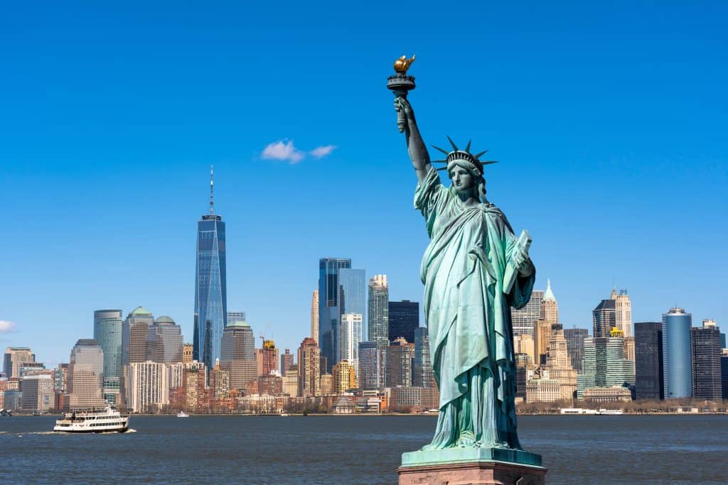 The,Statue,Of,Liberty,Over,The,Scene,Of,New,York