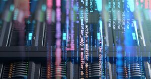 Close-up of illuminated servers inside a modern data center.